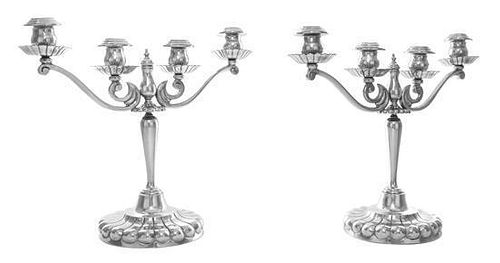 A Pair of Mexican Silver Four-Light Candelabra, Sanborns, Mexico City, Mid 20th Century, on lobed circular bases, the tapered st