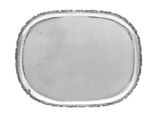 A Mexican Silver Tray, Maker's Mark GAD, Mid 20th Century, rounded rectangular with applied rim of scrolls and stylized foliage