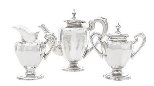 A Mexican Silver Three-Piece Coffee Set, Mid 20th Century, comprising a coffee pot, creamer, and sugar bowl, all of panelled vas