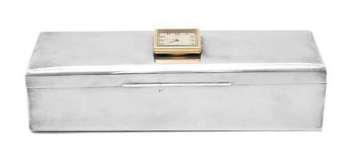 An American Silver Clock-Mounted Humidor, Cartier, New York, Circa 1943, rectangular, the hinged cover mounted with a square clo