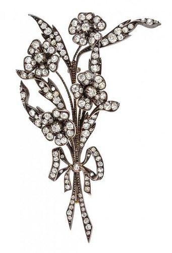 * A Victorian Silver Topped Gold and Diamond Flower Brooch, 16.20 dwts.