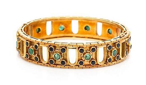 An 18 Karat Yellow Gold, Sapphire and Emerald Bangle Bracelet, Lalaounis, 36.65 dwts.