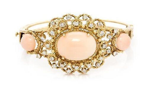 A Yellow Gold, Coral, and Diamond Bangle Bracelet, 23.10 dwts.