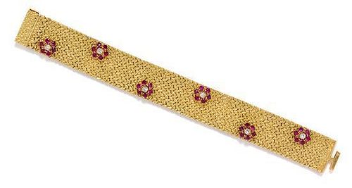 * An 18 Karat Yellow Gold, Ruby and Diamond Bracelet, British, Circa 1969, 46.80 dwts.