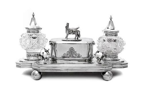 A Victorian Silver and Cut-Glass Inkstand, Josiah Williams & Co., Exeter, 1874, the shaped rectangular base raised on four ball