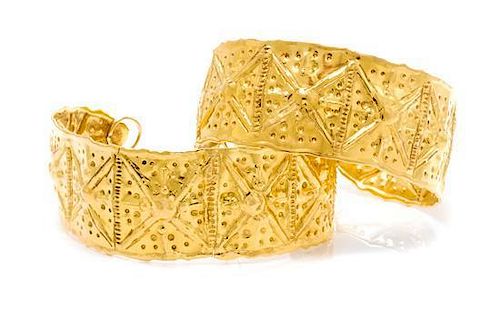 A Pair of High Karat Gold Cuff Bracelets, 33.00 dwts.