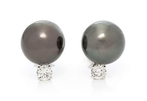 A Pair of 18 Karat White Gold, Cultured Tahitian Pearl and Diamond Earclips, 8.60 dwts.