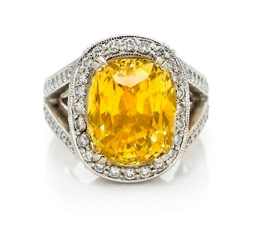 A Platinum, Gold, Yellow Sapphire and Diamond Ring, 15.80 dwts.