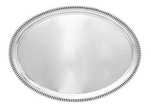 * A George III Silver Salver, William Bennett, London, 1802, oval with applied gadrooned rim, raised on four conforming bracket