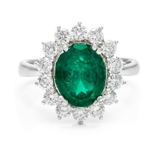 An 18 Karat White Gold, Emerald and Diamond Ring, 5.50 dwts.