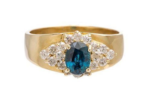 A 14 Karat Yellow Gold, Blue Topaz and Diamond Ring, 6.20 dwts.