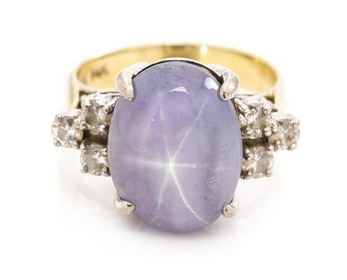 * A 14 Karat Bicolor Gold, Star Sapphire and Diamond Ring, 5.20 dwts.
