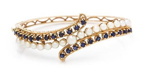 A Yellow Gold, Sapphire and Cultured Pearl Bangle Bracelet, 11.80 dwts.