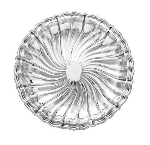 An American Silver Dish, Gorham Mfg Co., Providence, RI, 1953, shaped circular with stepped rim, the shallow bowl chased with sp