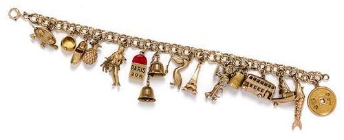A 14 Karat Yellow Gold Charm Bracelet with 15 Attached Charms, 26.00 dwts