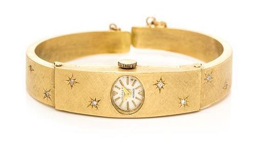 * An 18 Karat Yellow Gold and Diamond Bangle Wristwatch, Turler, 12.10 dwts.