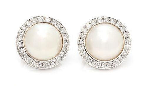 * A Pair of White Gold, Cultured Mabe Pearl and Diamond Earclips, 10.30 dwts.