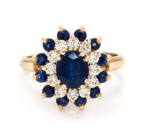 * An 18 Karat Yellow Gold, Sapphire and Diamond Ring, 4.80 dwts.