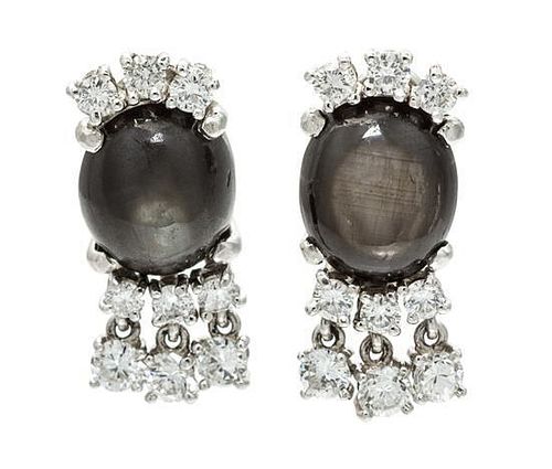 A Pair of White Gold, Black Star Sapphire and Diamond Earrings, 8.00 dwts.