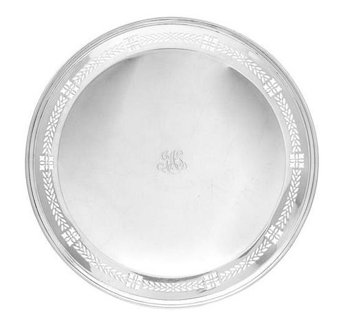 An American Silver Salver, Tiffany & Co., New York, NY, Circa 1930, circular raised on a short foot band, the border chased with