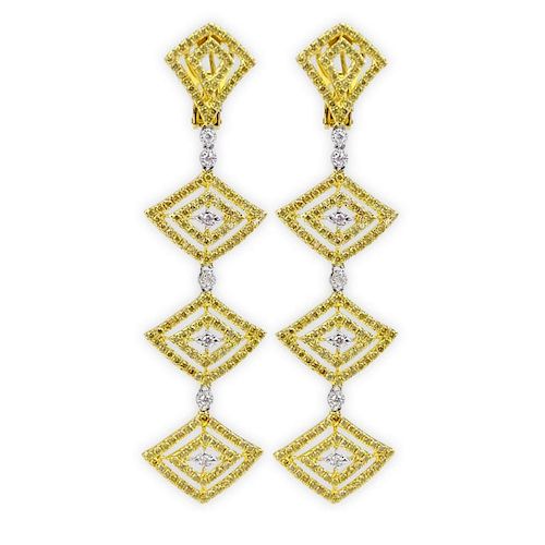 Pair of Modern Design Round Brilliant Cut Fancy Intense Yellow and White Diamond and 18 Karat Yellow Gold Chandelier Earrings.