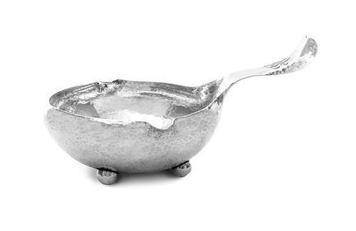 * An American Silver Sauce Boat, Whiting Mfg. Co., New York, NY, 1922, with spot-hammered surface, the circular bowl with two sm