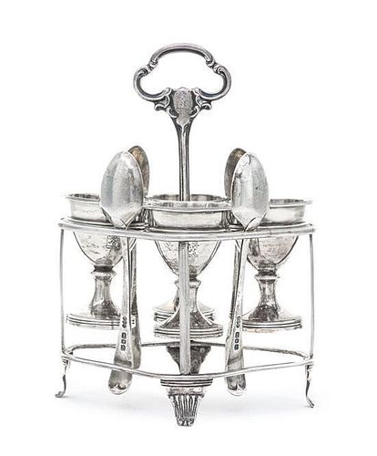 * A Victorian Egg Cup Holder, John Harris IV, London, 1847, the stand of shaped oval form raised on four reeded feet, central ha