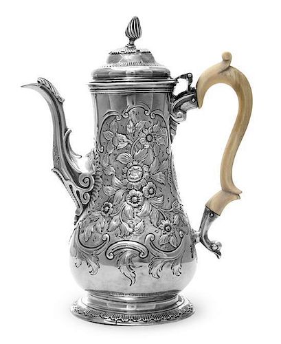 A George III Silver Coffee Pot, Richard Gurney & Thomas Cook, London, 1762, of pear form, the body later chased with dense flowe