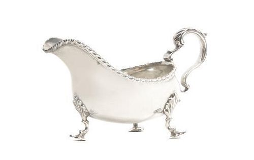 * An American Silver Small Sauce Boat, Retailed by HJ Howe, Syracuse NY, 20th Century, in Georgian style, with gadrooned border