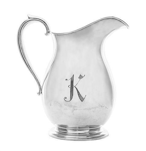 * An American Silver Water Pitcher, M. Fred Hirsch Co., Jersey City, NJ, Circa 1935, of baluster form with capped scroll handle,