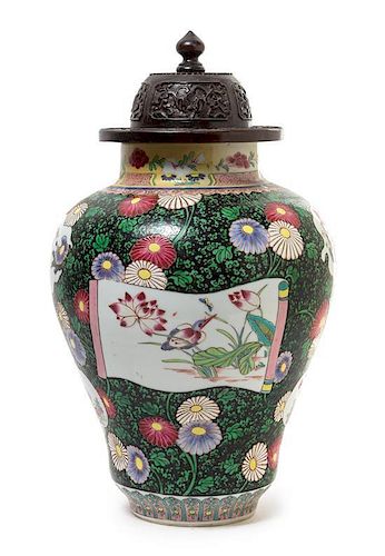 A Chinese Famille Noire Porcelain Jar Height of vase 15 1/8 inches. 粉彩花卉紋將軍罐，18世纪，高15.125英吋