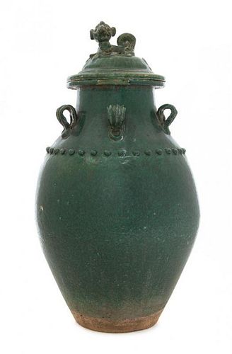 * A Green Glazed Earthenware Covered Jar Height 18 1/2 inches. 綠釉陶蓋罐，明，高18.5英吋