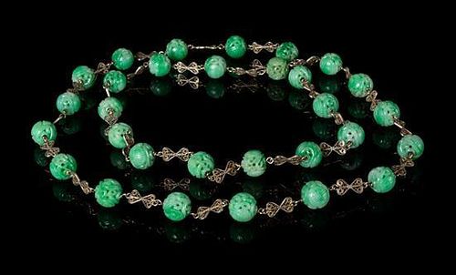 * A Beaded Jadeite Necklace Length 21 inches. 翡翠串珠项链，長21英吋