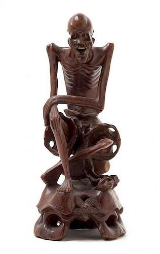 A Carved Rosewood Figure of an Immortal Height 10 1/2 inches. 硬木雕人物坐像，高10.5英吋