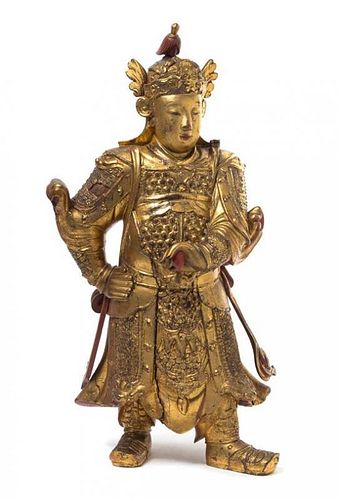 * A Gilt and Red Lacquered Wood Figure of Immortal Weituo Height 27 inches. 金漆木雕韋陀造像，高27英吋