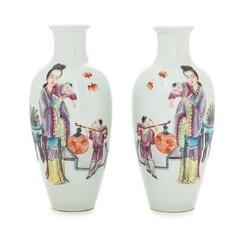 A Pair of Famille Rose Porcelain Vases Height of each 7 1/4 inches. 粉彩人物圖瓶一對，高7.25英吋