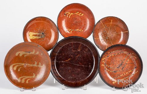 Six Pennsylvania redware plates, early 19th c.