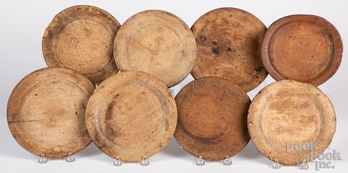 Eight turned wood plates, 19th c.