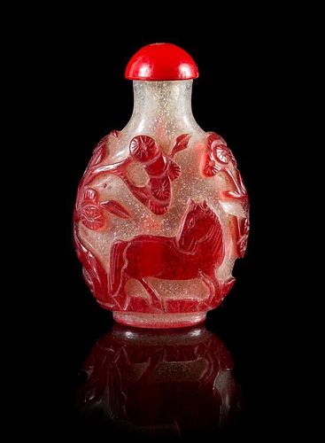 * A Red Overlay Peking Glass Snuff Bottle Height 2 5/8 inches. 雪霏地套紅料鼻煙壺，高2.625英吋