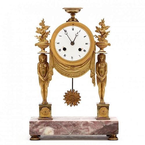 A French Egyptian Revival Gilt Bronze Mantel Clock