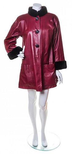 An Yves Saint Laurent Maroon Leather Swing Coat,