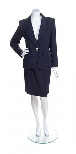 An Yves Saint Laurent Navy Wool Ribbed Skirt Suit, Size 38.