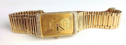 18k yellow gold Corum ladies wristwatch UBS (Union Bank Switzerland) ingot 10 gram face, diamond channel set surround 18k y.g. band, face numbered 235