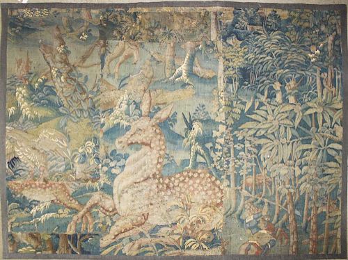 17th c Flemish verdure pieced tapestry fragment with a recumbent deer, trees, & foliage, descending in the family of John Jacob Astor IV, 4' 9ﾔ x 6'