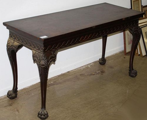 Great carved Chippendale hairy paw foot side table, walnut, mahogany and oak. 60"w x 32"h x 24"d. Late 19th c on early 20th.