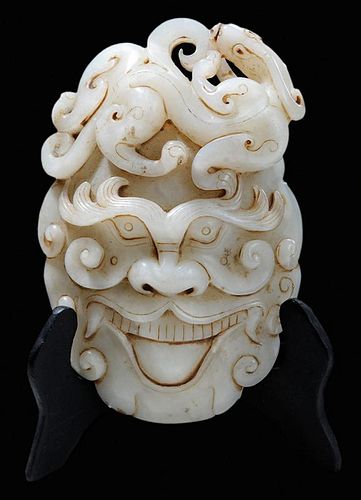 Finely Carved Jade Mask-Form Belt 玉雕人物头像上盘螭龙带黑柚木底座，高4.875英寸，中国
