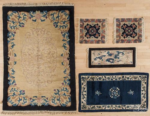 Semi-antique Chinese carpet, 7' x 4'7'', together with four mats.
