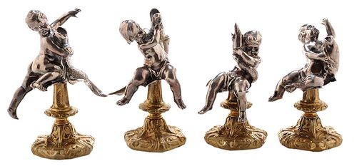 Set of Four Silver Putti and Dolphin