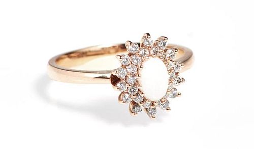 Lady's 14K Rose Gold Dinner Ring, with an oval cab