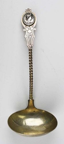 Aesthetic Movement coin silver ladle with twisted handle and medallion with a lady. Marked N&M. Approx 9ﾽ"l. 3.7 troy oz.